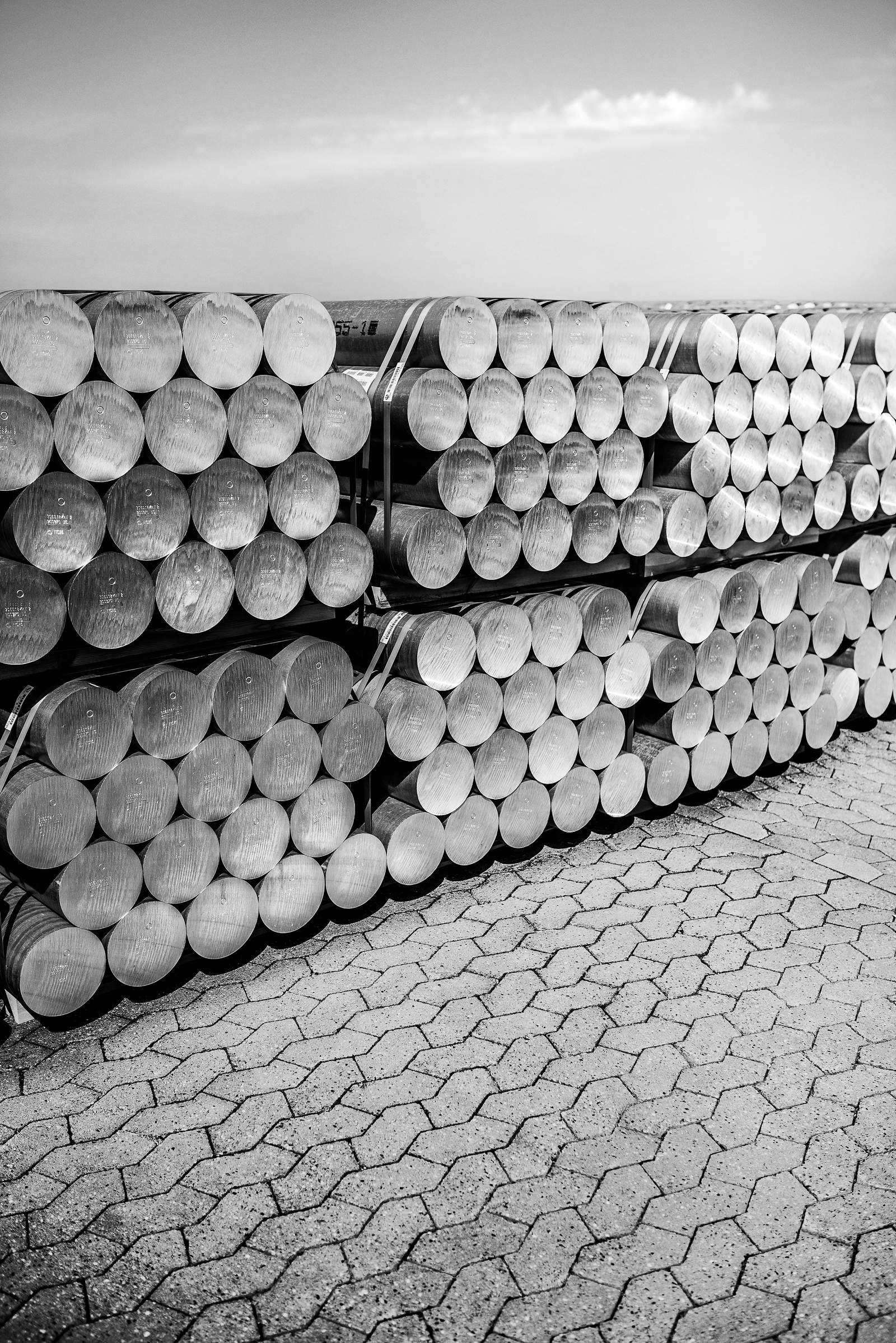 Stacks of aluminum billets outside a plant