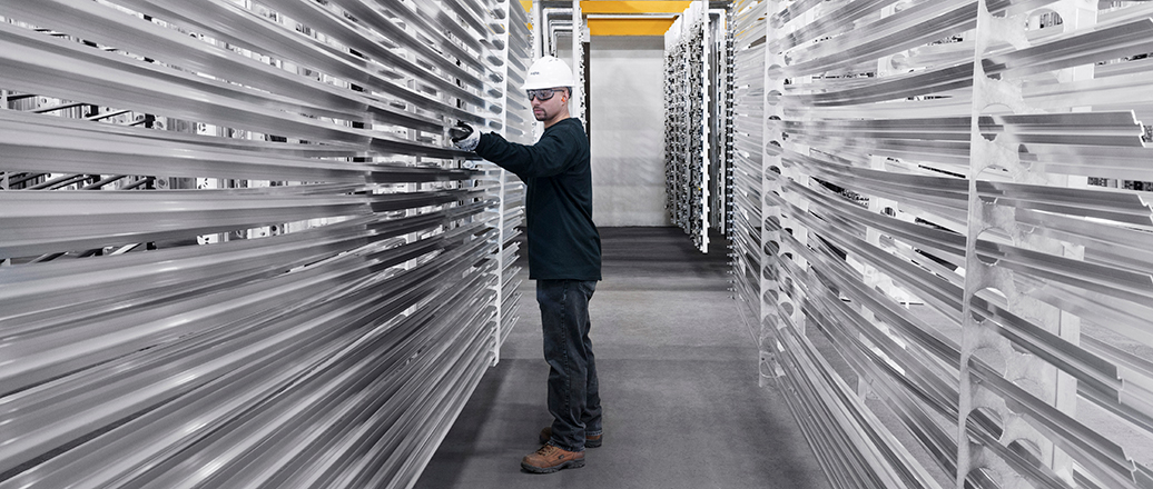 man racking extruded aluminum