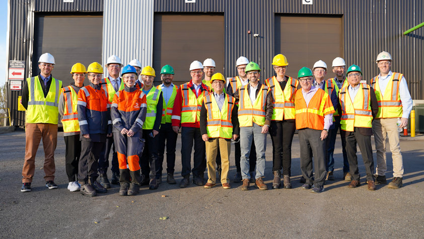 a group of people wearing safety vests