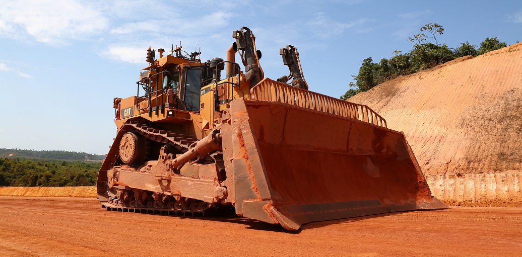 a bulldozer in a dirt field