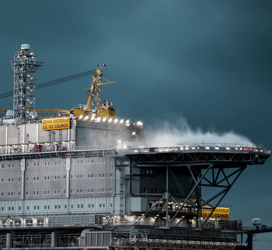 a large ship with smoke coming out of it